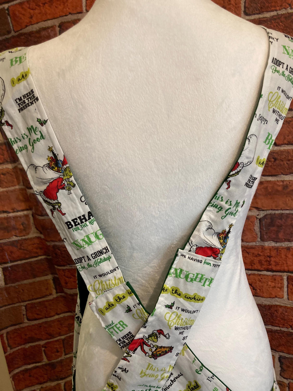 GRINCH CHRISTMAS SAYINGS on Reversible Cross Back Apron