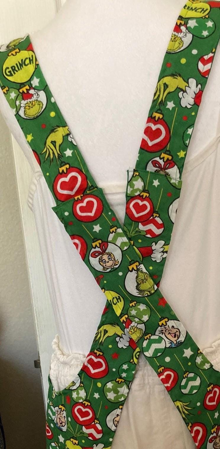 The Grinch Is in the House, Handmade reversible cross back apron, Yellow Grinch balloons,